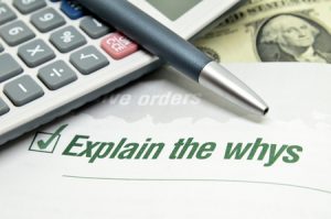 explain the whys printed on book with calculator and pen